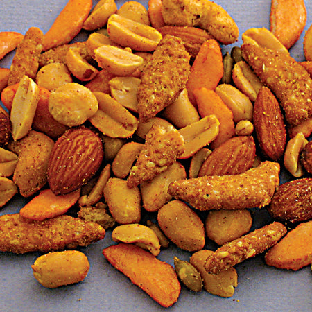 Cajun mix consisting of roasted and salted almonds, VA-P nuts, chili bits, pumpkin seeds, and sesame sticks in cajun powder